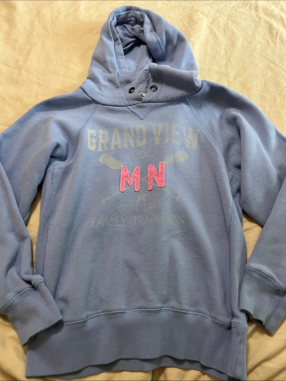 Blue 84 Light Blue Hoodie with Pink "MN" Graphic